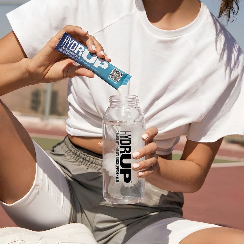 Atleta con stick y botella Hydrup
